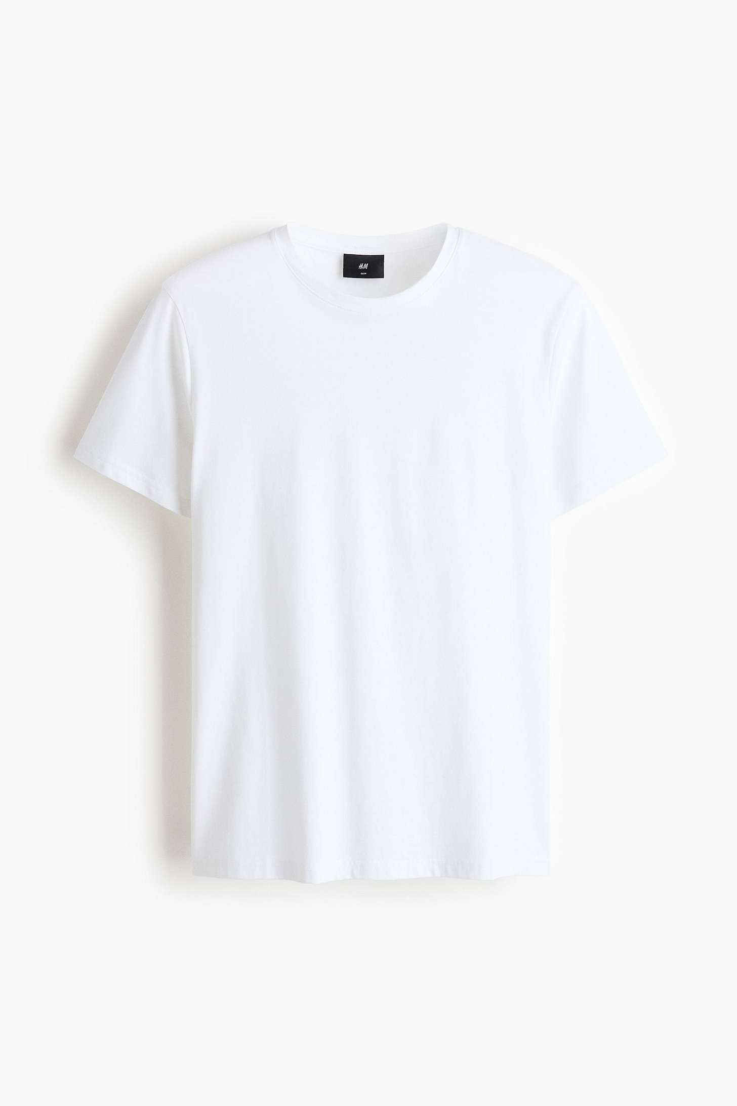 Ver imagen más grande: Una camiseta blanca de corte ajustado presenta su vista frontal. Cuenta con un escote redondo con un ribete finamente acanalado, mangas cortas y un dobladillo de corte recto. Una etiqueta de marca negra es visible en la parte posterior del cuello.