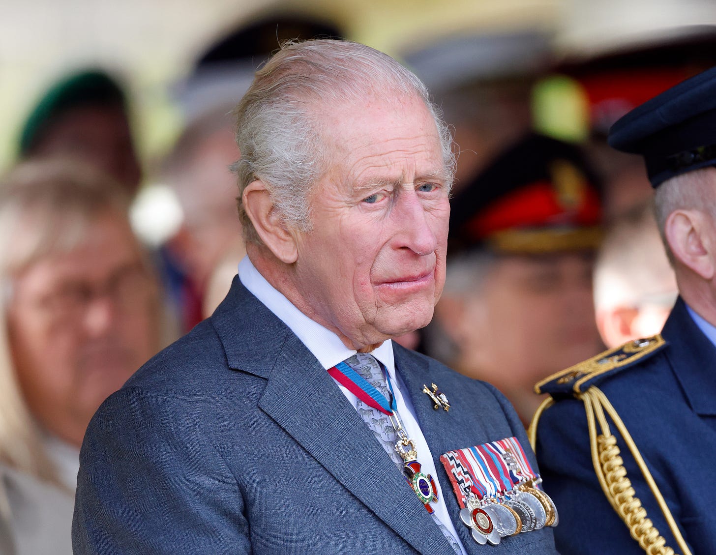 King Charles frowning wearing a suit King Charles frowning wearing a suit