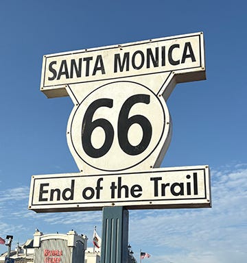 Picture of the end of the trail on Rt 66, Tail o' the Pup, and the author and Kevin Patrick, tour guide