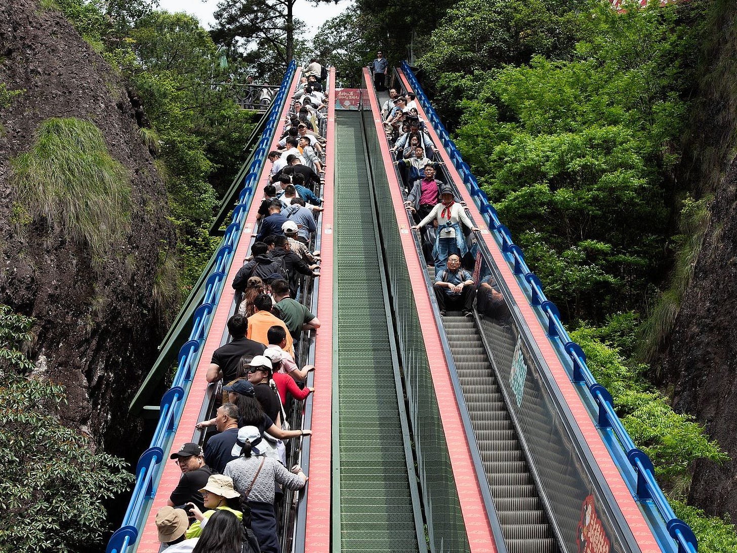 Tourists on escalator in China painless tourism Tourists on escalator in China painless tourism