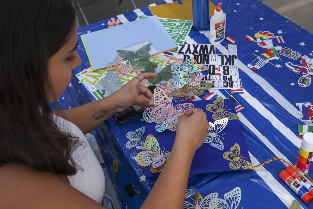 Nursing student Nicole Viramontes, 22, arranges butterfly cutouts on her mortarboard during the Grad Cap Decorating Event in front of the Student Services Building on Wednesday, May 28. Viramontes says she was drawn to the butterflies because they reminded her of her late cousin, Victoria. "I want to have some memory of her as she would have graduated before me," she said. (Erica Lee | The Union) Nursing student Nicole Viramontes, 22, arranges butterfly cutouts on her mortarboard during the Grad Cap Decorating Event in front of the Student Services Building on Wednesday, May 28. Viramontes says she was drawn to the butterflies because they reminded her of her late cousin, Victoria. "I want to have some memory of her as she would have graduated before me," she said. (Erica Lee | The Union)