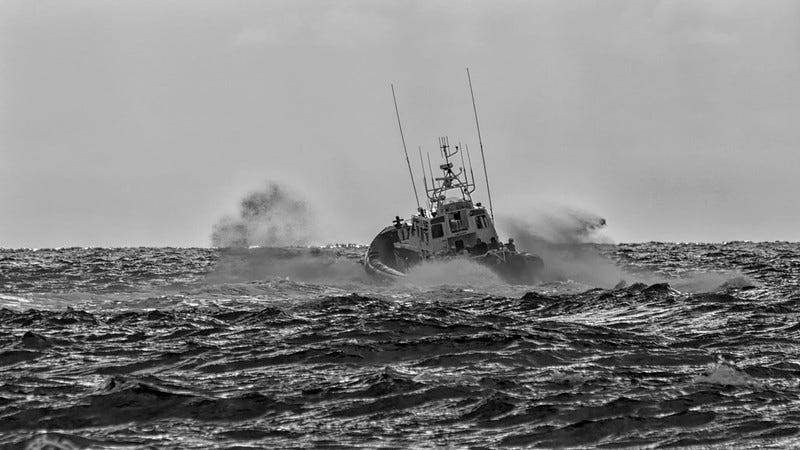 A pontoon boat in a rough sea A pontoon boat in a rough sea