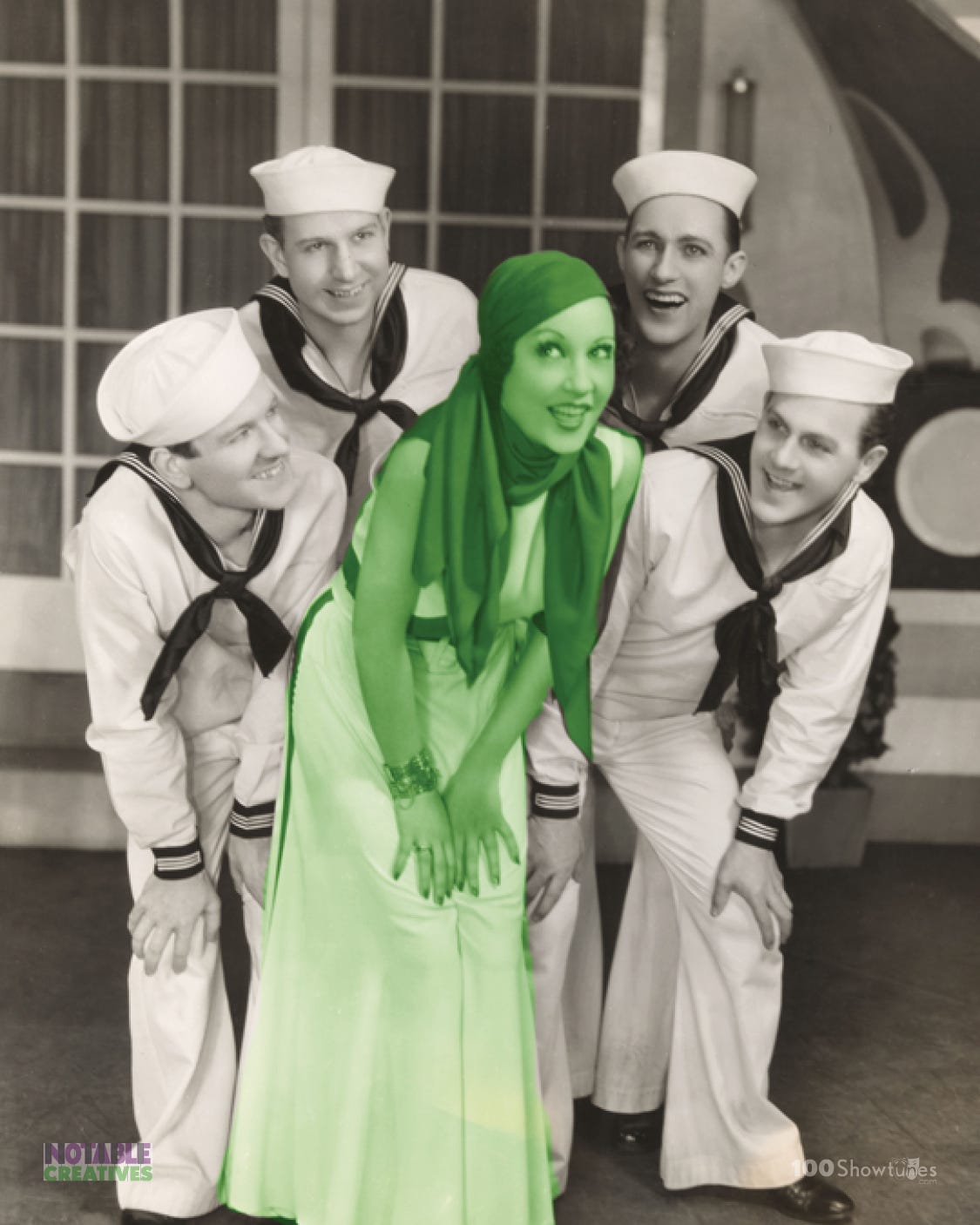 A tinted photo of Ethel Merman and some sailors in the original Broadway cast of Anything Goes by Cole Porter, Guy Bolton, P.G. Wodehouse, Howard Lindsay, and Russel Crouse. A tinted photo of Ethel Merman and some sailors in the original Broadway cast of Anything Goes by Cole Porter, Guy Bolton, P.G. Wodehouse, Howard Lindsay, and Russel Crouse.