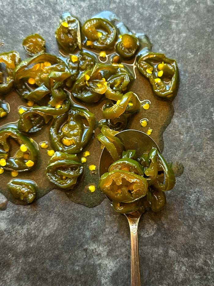 Homemade Candied Jalapeños (Cowboy Candy) are sweet, spicy, tangy, and incredibly easy to make. A delicious way to preserve fresh jalapeños and add flavor to burgers, sandwiches, tacos, and more.