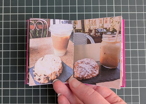 image 1; a small booklet held in a woman's hand, the cover is magenta pink with a black map pin in the center and the words "my two cities" in white. image 2, a woman's hand holds up the booklet, the spread shows to similar photos. the photo on left shows a large flowering tree with bright pink and white blooms behind the tree is a house with faded yellow wood siding, on the right the photo shows a small flowering tree with bright pink and white blooms, behind the tree is an apartment building made of pale yellow stucco. image 3, a woman's hand holds open the booklet, the spread shows two similar photos. the photo on the left shows a gothic archway through the archway we see stairs leading up to trees and a lone figure silhouetted, the photo on the right shows a tall carved stone archway, there are people in the foreground and through the archway we see a pale sky a long statue silhouetted. image 4, a woman's hand holds up the booklet, the spread shows two similar photos, the photo on the left shows various posters and flyers interspersed with graffiti on a dark brown door, the photo on the right shows a wall completely covered in flour pasted flyers and posters. image 5, a woman's hand holds up the booklet, the spread shows two similar photos, the photo on the left shows an iced coffee drink in a plastic cup and a iced blueberry scone on.a black napkin on a rustic wood table with an empty wood cane chair in the background, the photo on the right shows an iced coffee drink in a glass mason chair and a croissant covered in powdered sugar on a black stone tray sitting on a smooth wooden table, there's am empty white woven chair in the background. image 6, a woman's hand holds up the booklet, the spread shows two similar photos, the image on the left shows the tops of trees and small homes and flat top apartment buildings, the sky is pale yellow and blue and a few dark blue clouds dot it, the image on the right shows the tops of white homes and apartments with dark red terracotta shingles on the roofs, the sky is pale blue and yellow with dark blue and bright pink clouds. image 7, a woman's hand holds open the booklet, the spread shows two similar photos, the photo on the left shows a white gallery wall featuring many framed art works in varying sizes and shapes. a long man in a khaki shorts and blue shirt stands to the left looking up at the artwork, the photo on the right shows a large beige curved wall featuring many hanging loose canvases painted in bright warm colors, a lone man stands to the right in all black looking up at the canvases. image 8, a woman's hand holds open the booklet, the spread shows two similar photos, the photo on the left is a woman's left hand holding an ice cream cone with two scoops, the ice cream is white with brown flecks, the background shows a blurry concrete sidewalk, the photo on the right show's a woman's left hand holding an ice cream cone, the ice cream is dark chocolate and artfully arranged into petals to resemble a rose, the background is a blurry tiled sidewalk in white and black. image 9, a woman's hand holds open the booklet, the spread is two similar photos, the photo on the left is a bright blue sky with fluffy white clouds over the NYC skyline, the photo on the right shows the sky in the exact same bright blue shade with white fluffy clouds that seem to connect with the clouds from the photo on the left, the buildings at the bottom of the photo are white with bright red terracotta roofs