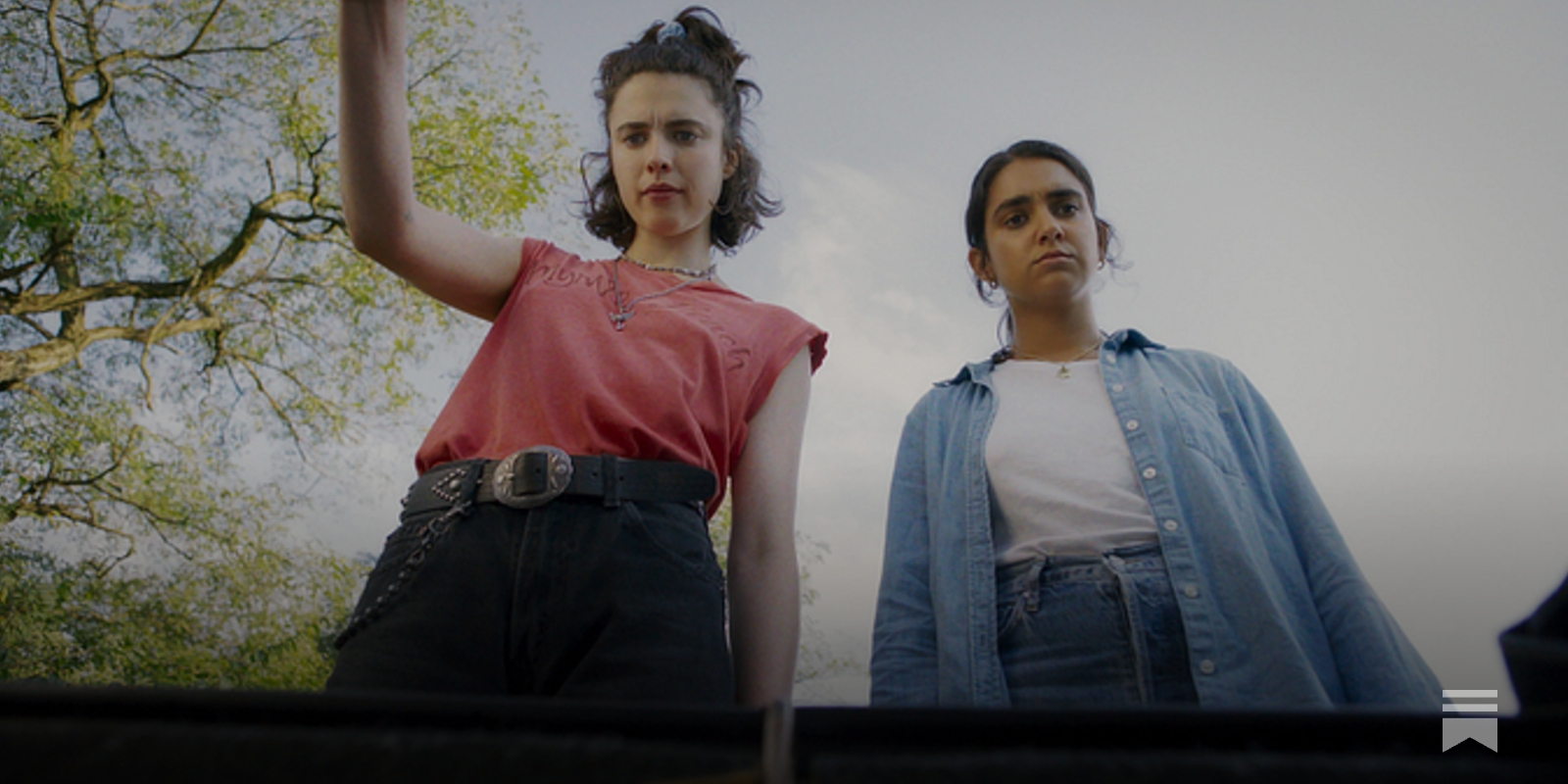 A person deep in thought, illuminated by a screen