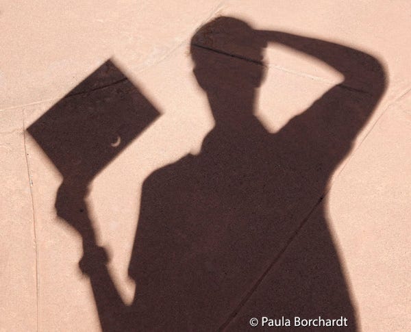 Self-portrait of me holding my high tech eclipse viewing device during a solar eclipse