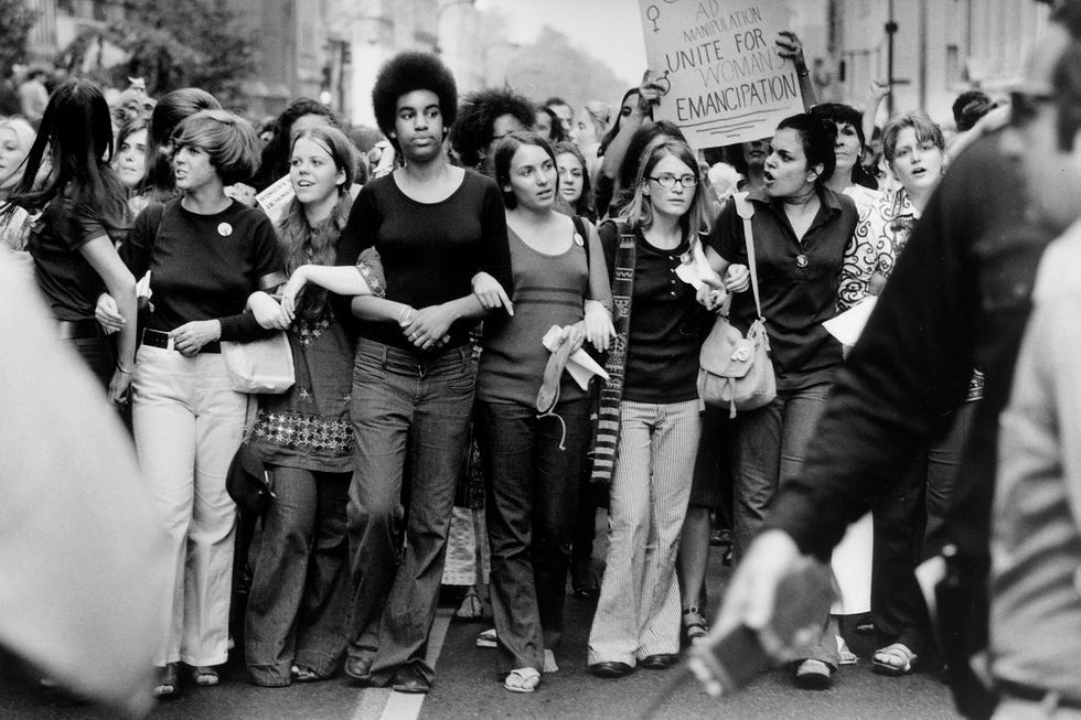Vintage fashion and diverse faces on a busy Fifth Avenue sidewalk, 1970s. Vintage fashion and diverse faces on a busy Fifth Avenue sidewalk, 1970s.