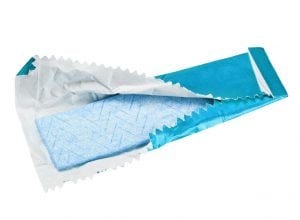 chewing gum is on the white background with paper