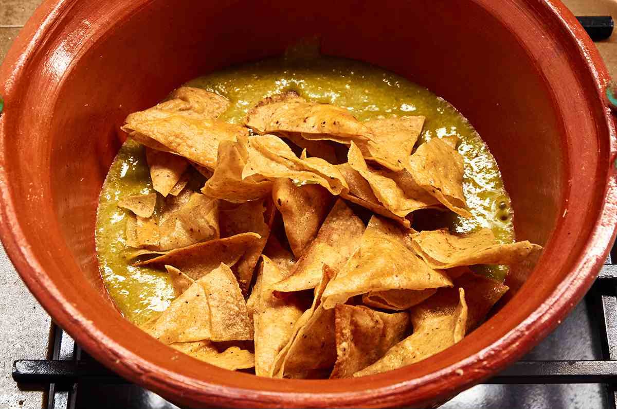 tortilla chips in pot with salsa verde