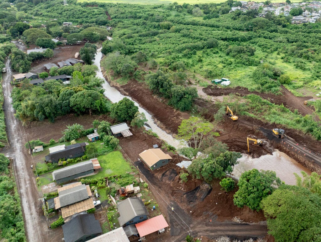 Otake Camp next to Kaukonahau Stream April 9, 2026. State, city and county crews at right have been dredging the stream adjacent to the camp. (Craig Fujii/Civil Beat/2026)