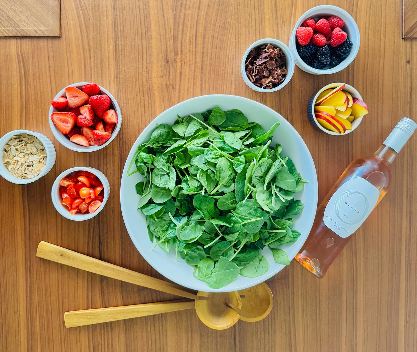 Ingredients for a summer spinach salad with smoked bacon, fresh berries, nectarine, tomatoes, toasted almonds in a balsamic shallot vinaigrette paired with a Provençal rosé. Ingredients for a summer spinach salad with smoked bacon, fresh berries, nectarine, tomatoes, toasted almonds in a balsamic shallot vinaigrette paired with a Provençal rosé.