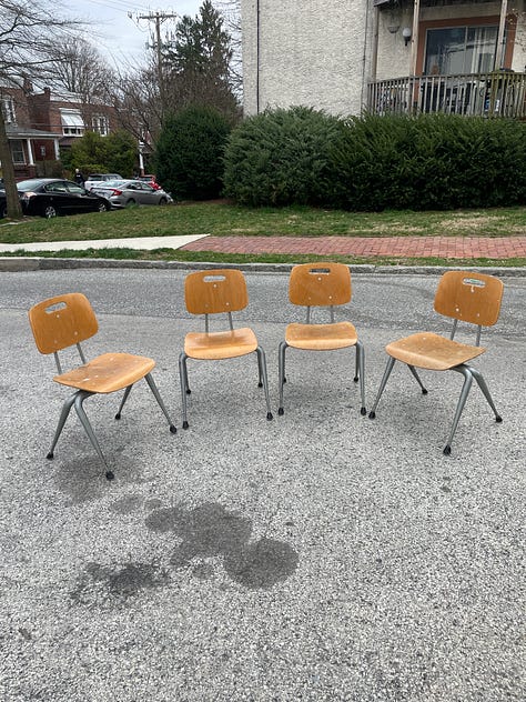 A table, some trapped astronaut table lamps, a rosewood desk, a dansk ice bucket, four Raymond Loewy chairs, and a Falster danish teak night stand.