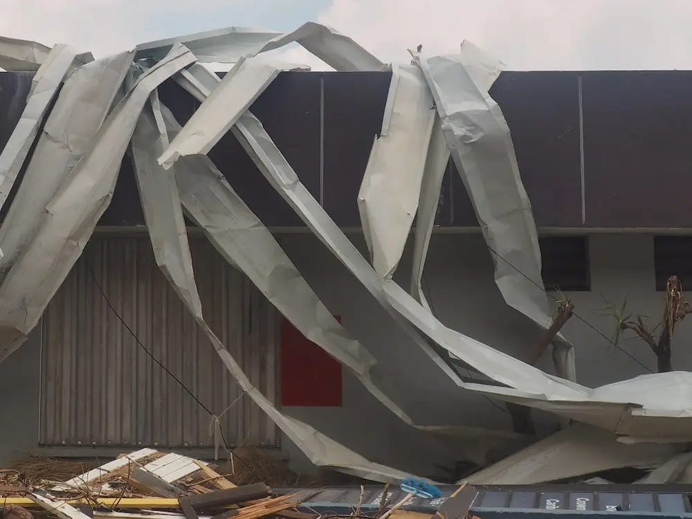 Mangled metal envelops a store