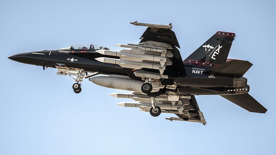 A U.S. Navy F/A-18F carrying a very heavy air-to-air payload that includes four AIM-174B very long-range air-to-air missiles A U.S. Navy F/A-18F carrying a very heavy air-to-air payload that includes four AIM-174B very long-range air-to-air missiles