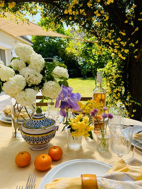 Scenes of a spring garden in the French countryside. Roses, fuchsia, hydrangeas