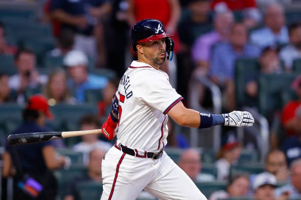 Whit Merrifield of the Atlanta Braves hits a single during the third inning against the Colorado Rockies at Truist Park on September 3, 2024 in...