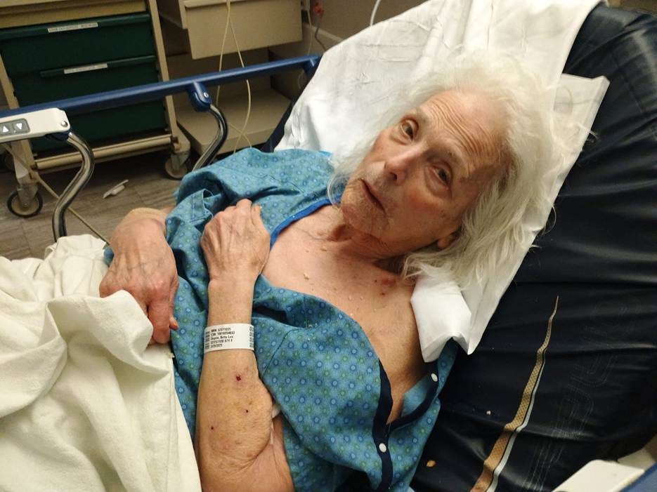 An old person lying in a hospital bed

AI-generated content may be incorrect.