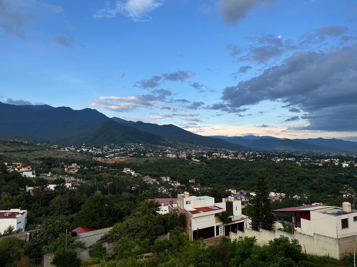 A landscape photo of Mexico with mountains in the background.