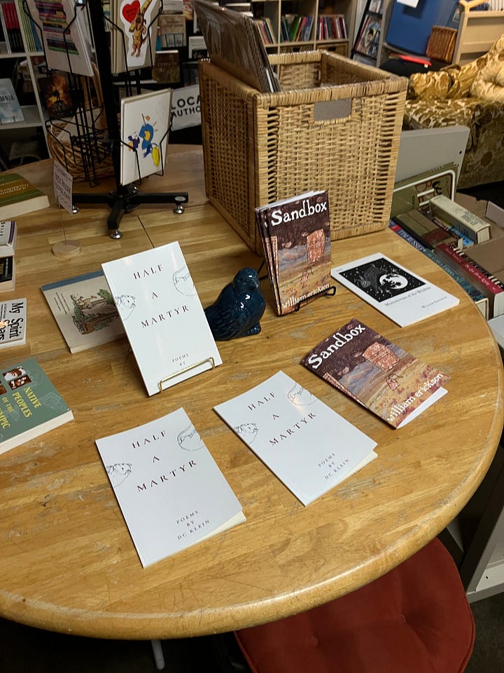 1. A table with my chapbook and Will's. 2. Will reading a poem and me listening.