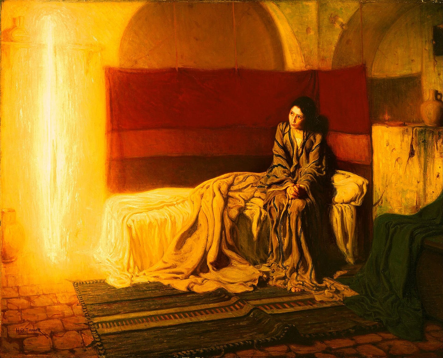 A barefoot teenage girl in a rumpled striped robe sits on the edge of an unmade bed in a simple stone room hung with rugs, her hands clasped in her lap, looking up at a tall column of golden light standing in the room at the left. A shelf on the wall crosses the column near the top.