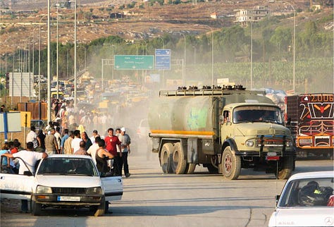 Dr. Mohammad Osman's office, shattered windows. Traffic heading south. Bombed bridges. Mattresses on cars. Photos by Constantine Markides