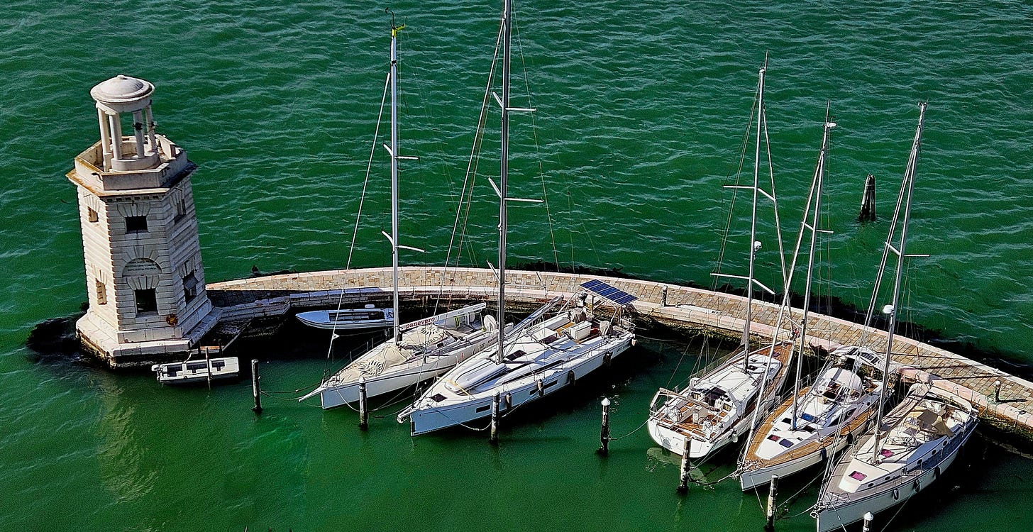 Decorative image of a pier with sailboats Decorative image of a pier with sailboats