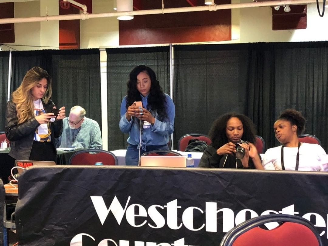Women sports journalists working a basketball event, representing the early generation of digital women's basketball media coverage Women sports journalists working a basketball event, representing the early generation of digital women's basketball media coverage
