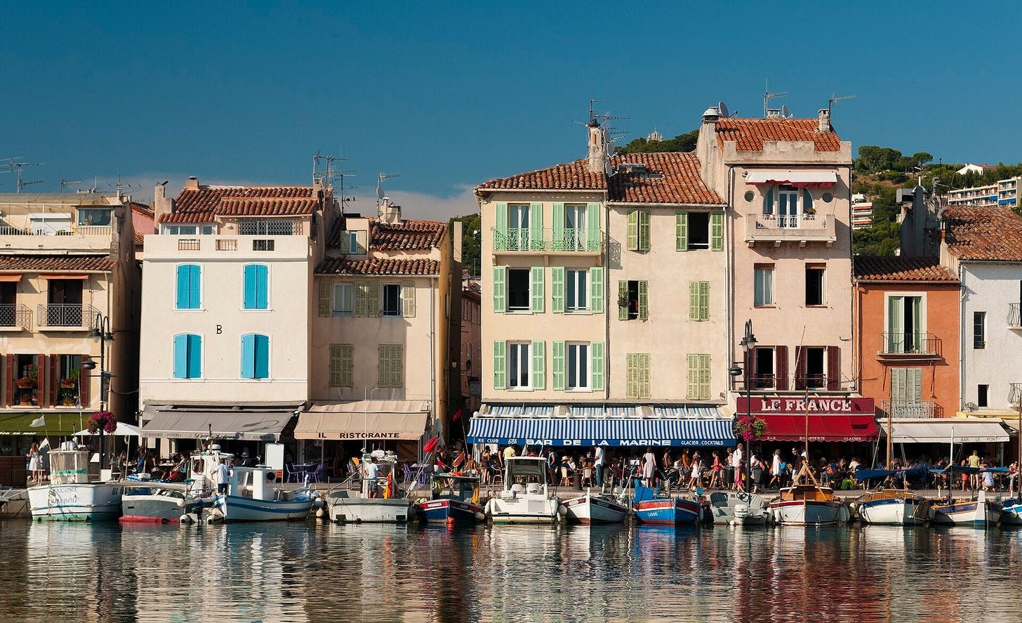 Fishing boats and pastel facades on the harbour of Cassis Fishing boats and pastel facades on the harbour of Cassis