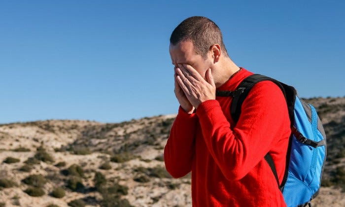 A depressed man with a headache.