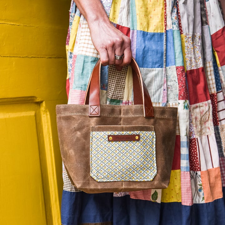 waxed canvas tote with vegetable tanned leather and antique textiles