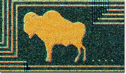 Image of a buffalo, trailing buffalo chips, etched on a digital filter chip from the HP3582a audio spectrum analyzer. Buffalo by Kathy Mazzotta, Yvette Norman, and Sandy Shertzer. From the Molecular Expressions: Silicon Zoo website of Florida State University, by permission of Prof. Michael W. Davidson Image of a buffalo, trailing buffalo chips, etched on a digital filter chip from the HP3582a audio spectrum analyzer. Buffalo by Kathy Mazzotta, Yvette Norman, and Sandy Shertzer. From the Molecular Expressions: Silicon Zoo website of Florida State University, by permission of Prof. Michael W. Davidson
