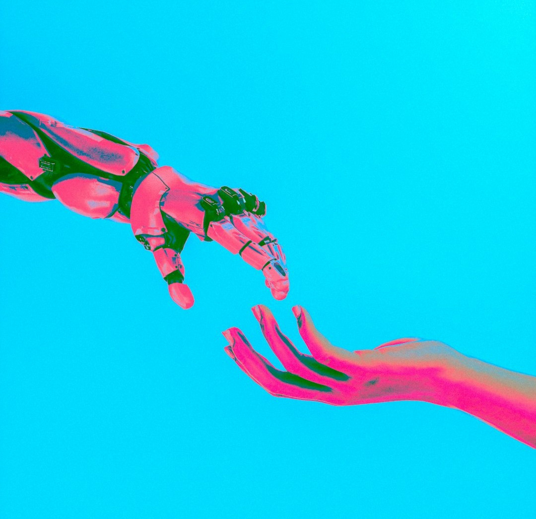 two hands reaching for a flying object in the sky