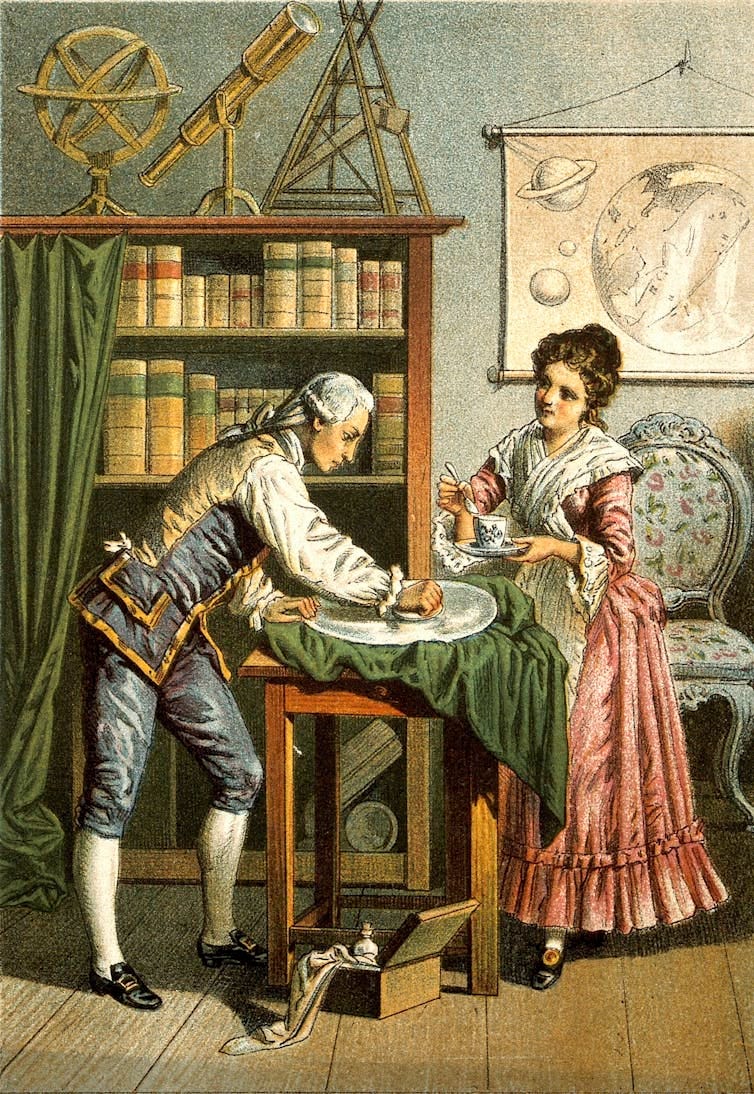 An illustration of two people, and man and a woman, leaning over a table. The man polishes a lens on the table. Other astronomical instruments are visible behind them. An illustration of two people, and man and a woman, leaning over a table. The man polishes a lens on the table. Other astronomical instruments are visible behind them.