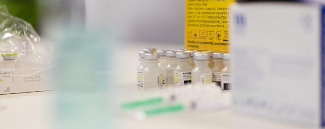 yellow and white labeled bottle