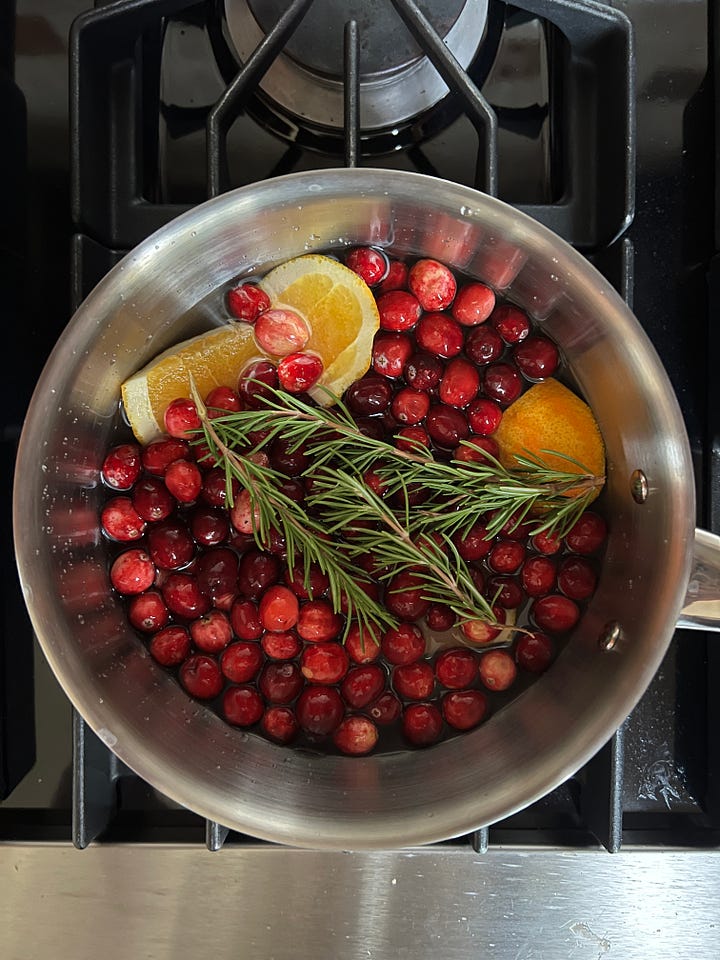 Cranberry rosemary syrup in the pot and after it's jarred.