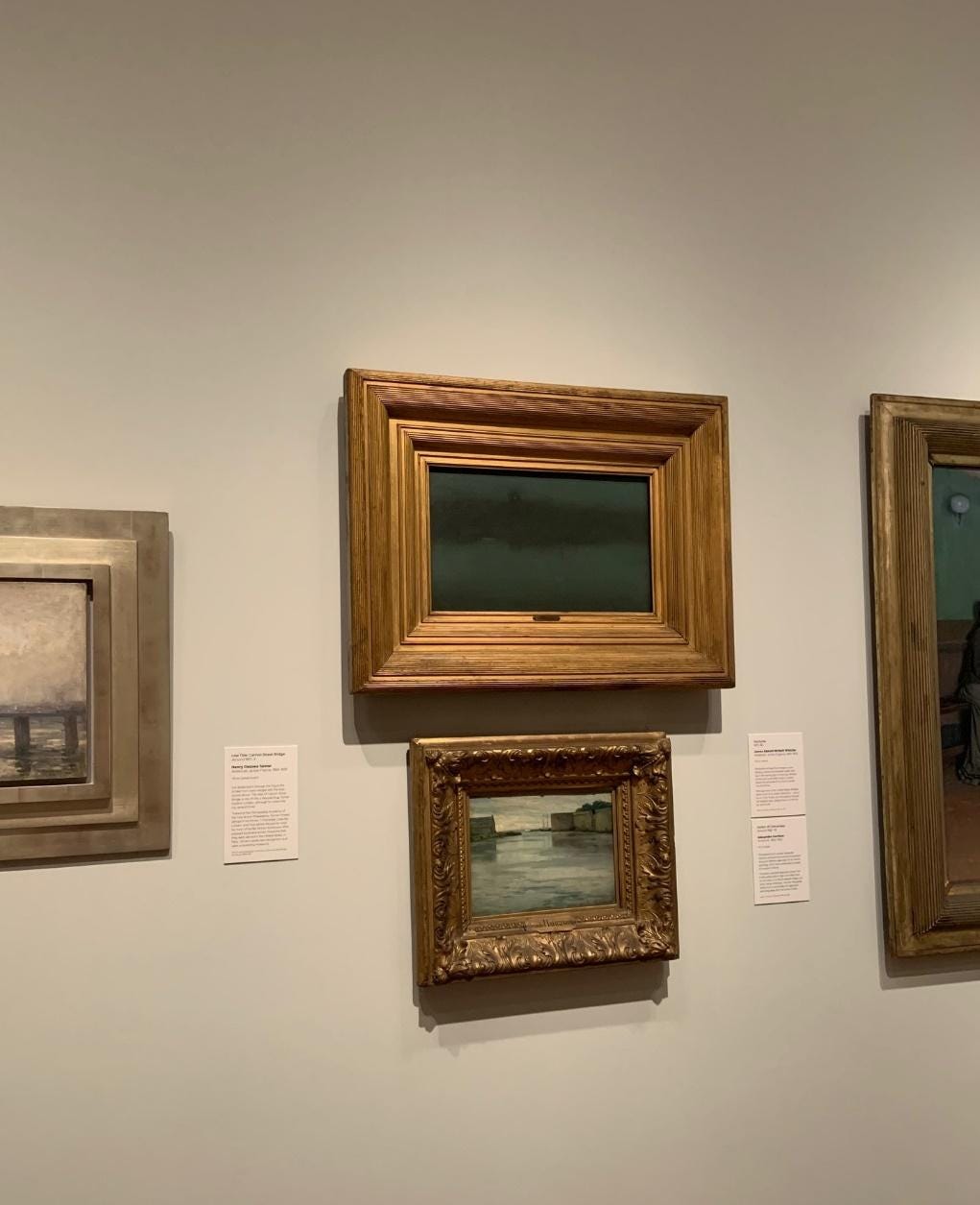 A group of framed pictures on a wall

Description automatically generated