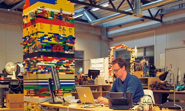 A person sitting at a desk with a computer

AI-generated content may be incorrect.