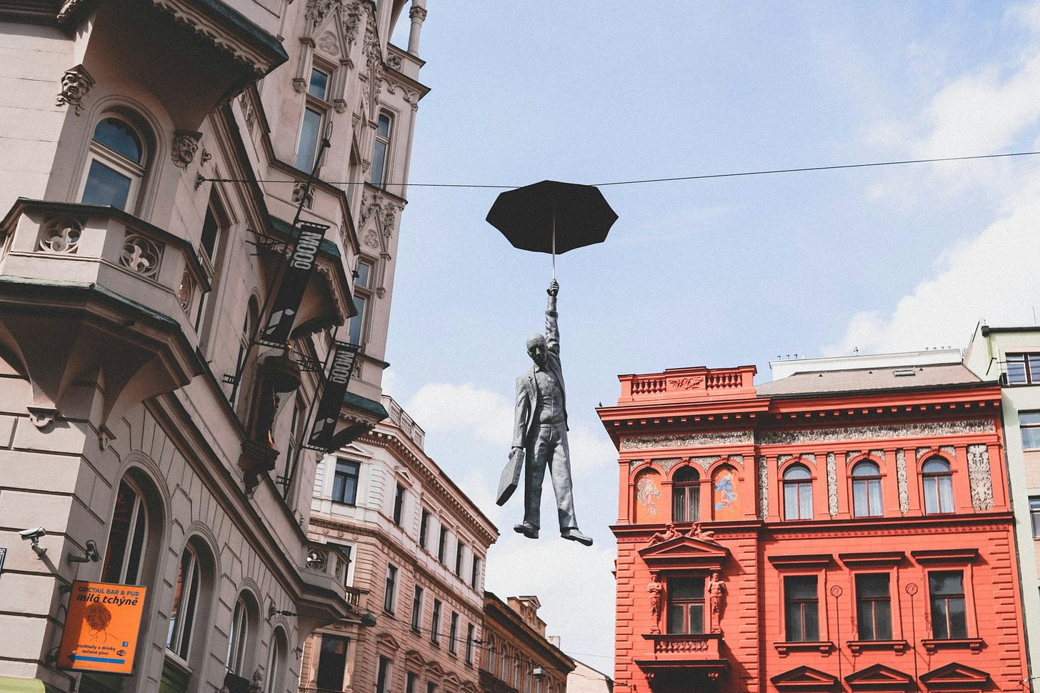 man in suit holding umbrella statue man in suit holding umbrella statue
