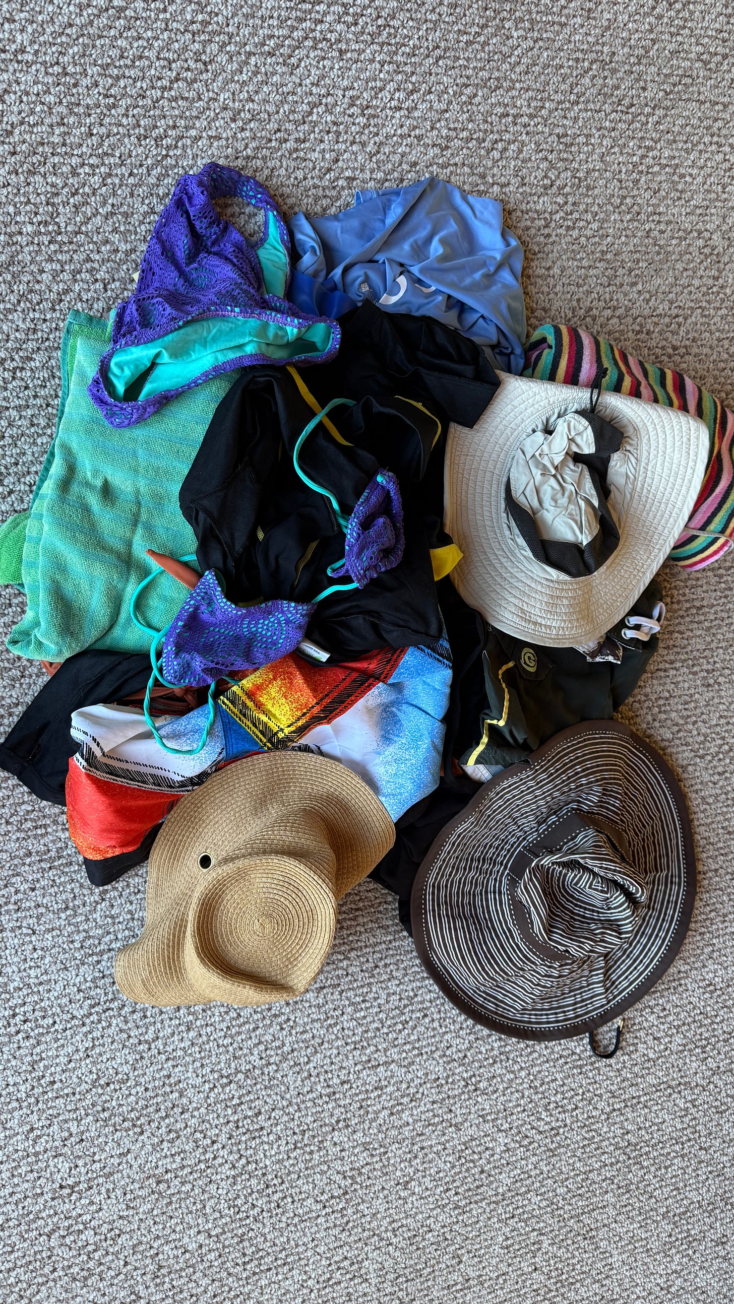 A bunch of beach gear on the floor