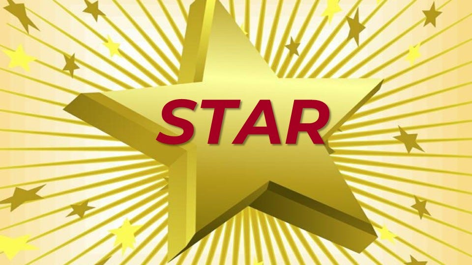 Bright yellow 3-dimensional star in the middle of the image with rays coming out from behind the star with smaller stars. The word STAR is in red in the middle of the star. Bright yellow 3-dimensional star in the middle of the image with rays coming out from behind the star with smaller stars. The word STAR is in red in the middle of the star.