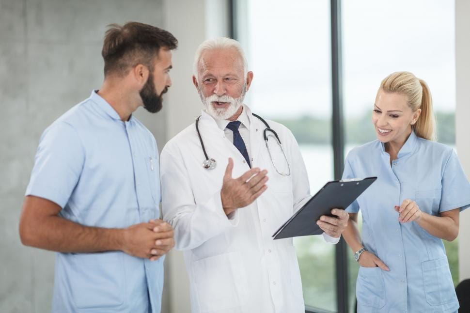 Free Stock Photo of Medical team discussing with senior doctor | Download  Free Images and Free Illustrations