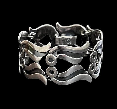 https://www.rubylane.com/item/2013583-ABG192/Taxco-Sterling-Floral-Motif-Link-Bracelet