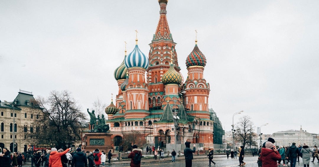 people walking on street near brown and green building during daytime