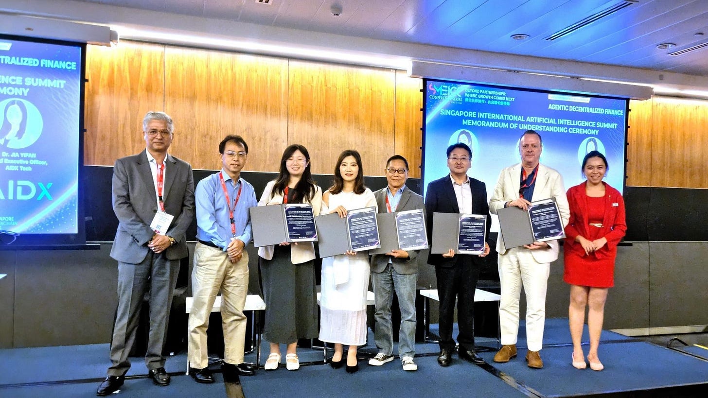Memorandum of Understanding ceremony featuring (from left)  Dr. Kamal Anand - Founder, Bingold Inc ; Mr. Zhang Hai Sheng - COO, Singapore Innovation Centre ; Dr. Jia YiFan - CEO, AIDX ; Ms. Phoenix Chen  - Co-Founder, China-Singapore AI Association ; Dr Charlie In - Founder, Raffles Capital ; Mr. Qiu JingYing - Director-General of Singapore Representative Office, HICOOL Global Entrepreneur Summit by Beijing Overseas Talents Association ; Richard Hobbs - Founder, VIA Labs with Animoca Brands ; Ms. Wendy Yew - Secretariat, Singapore Chinese Chamber of Commerce And Industry.
