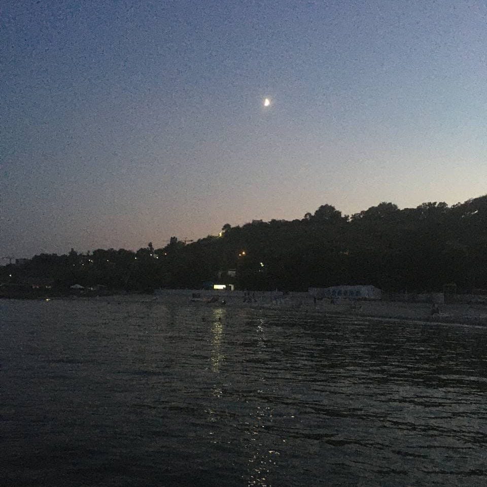 A look at a beach from a pier during a night walk