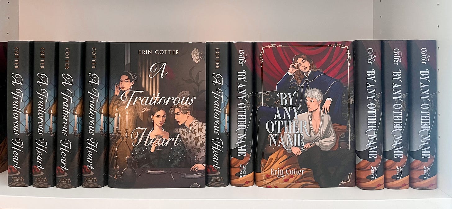 a shelf full of the author's own books. 
