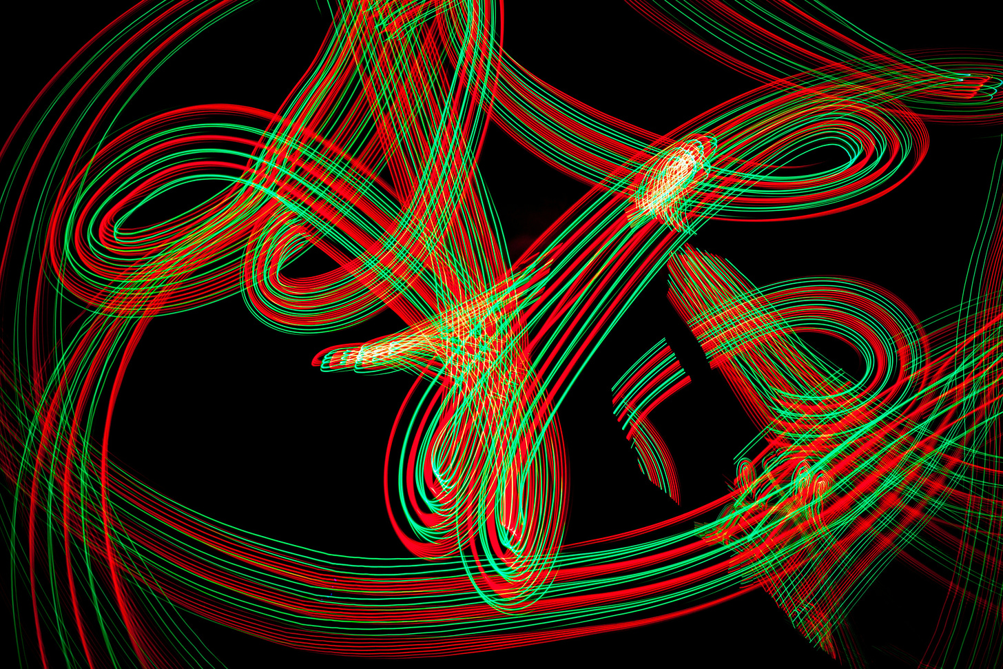 abstract string theory art time lapse photography of red and green lights
