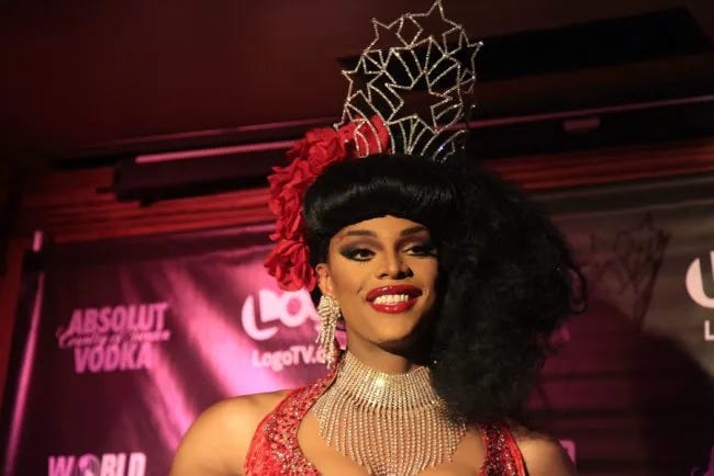 James Ross as Tyra Sanchez wearing the prize crown