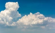 Clouds gathering in a blue sky.